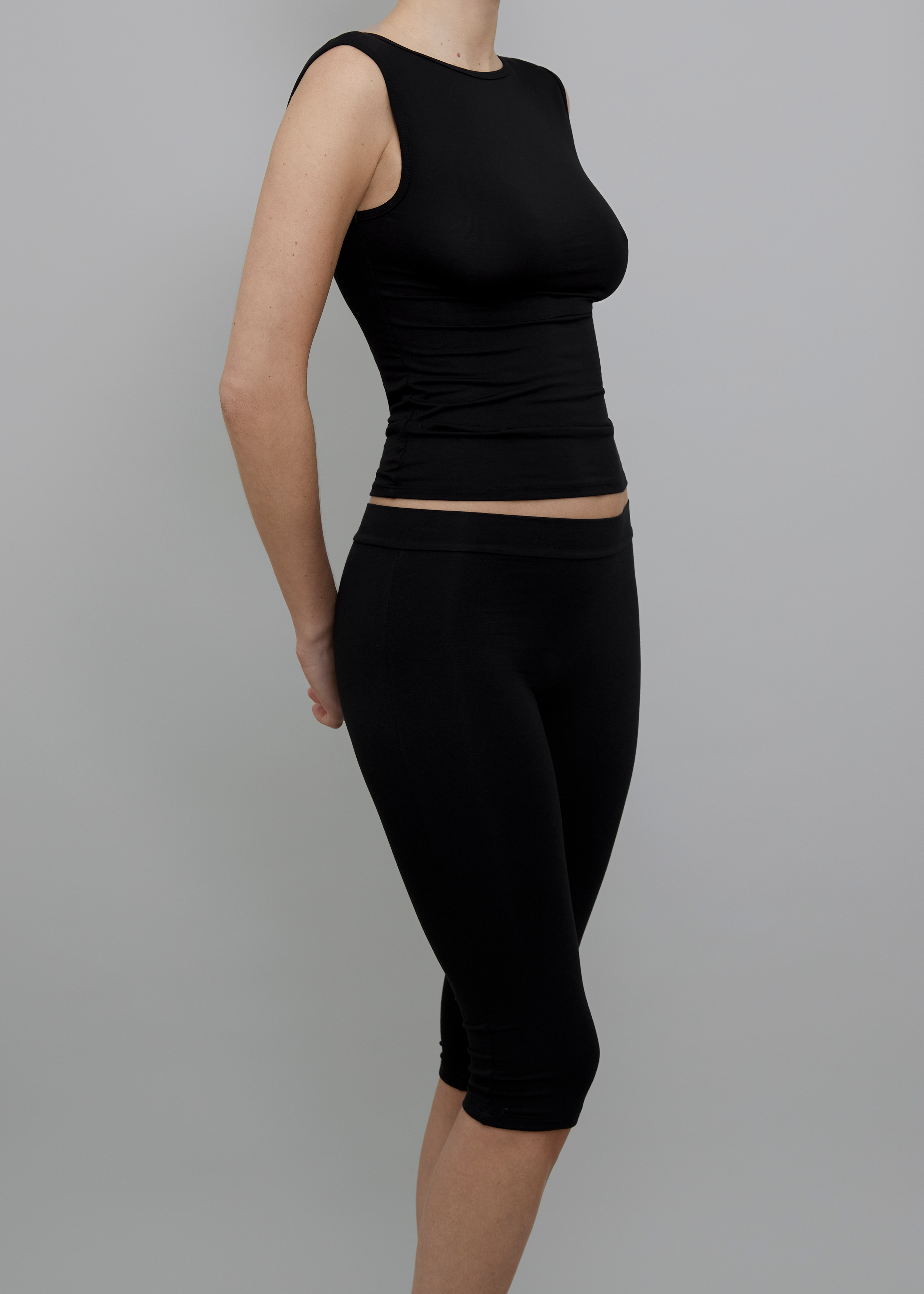 Side View of Recline Bateau Sleeveless Top in Black from KYE Intimates in Los Angeles.
