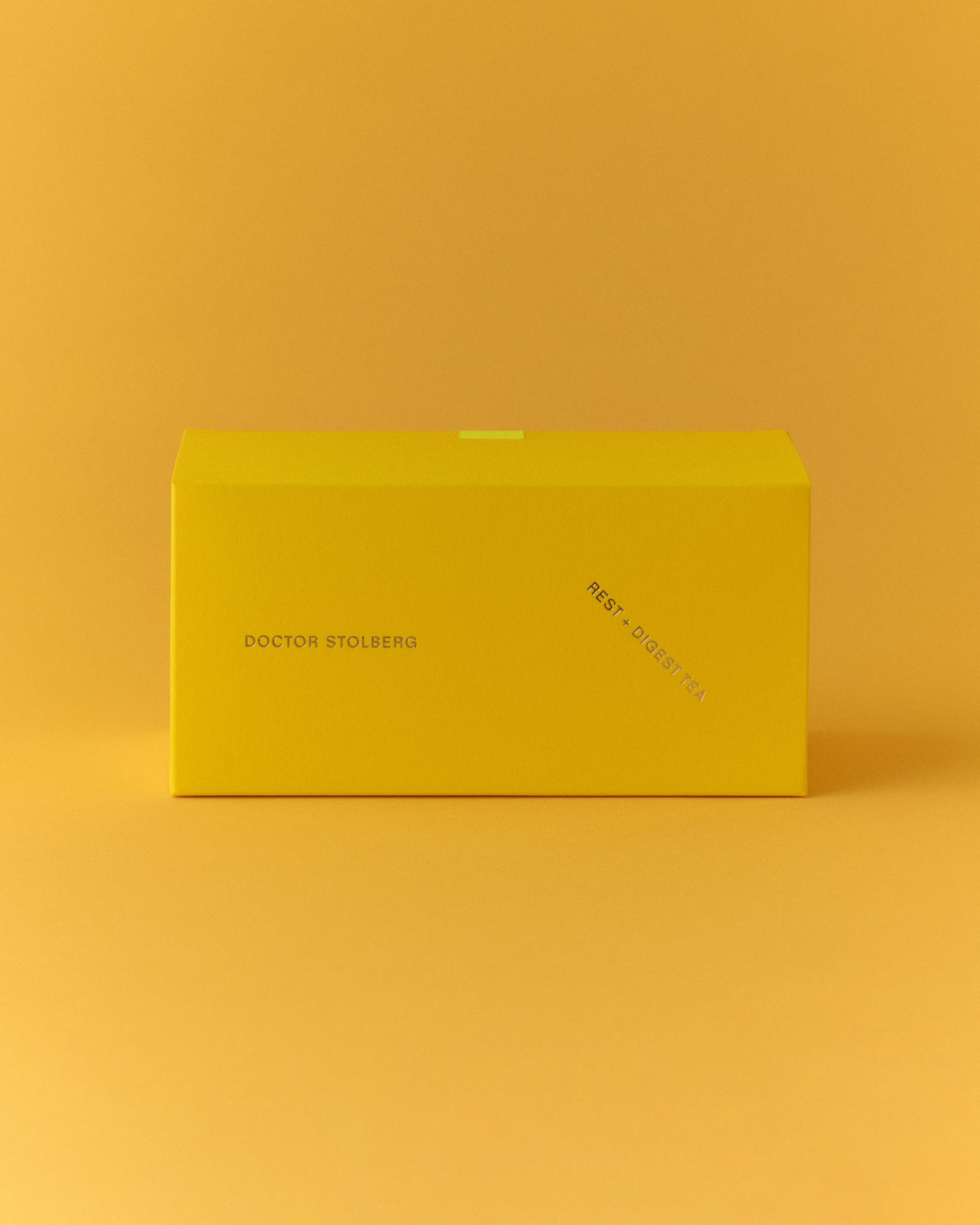 Rest + Digest Tea box on a yellow background